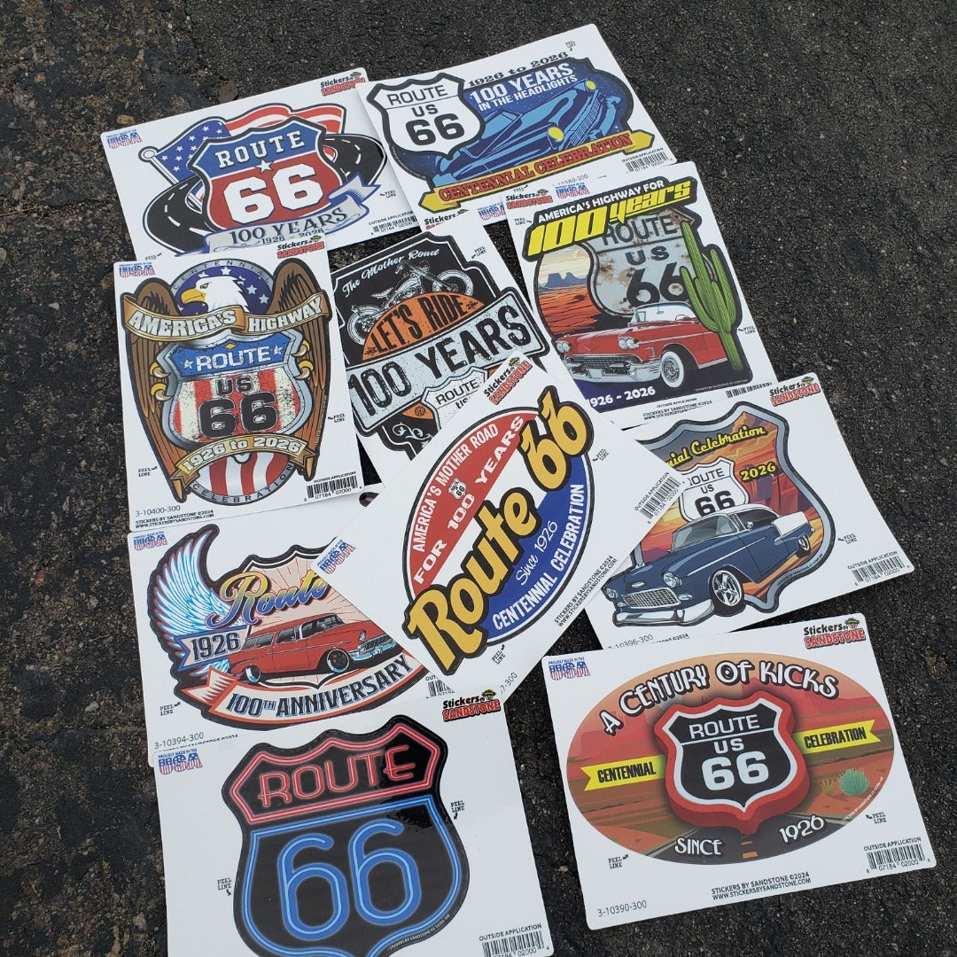 A pile of Route 66 Centennial stickers.