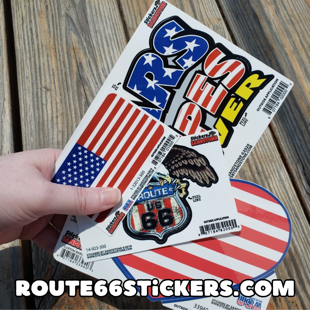 USA-themed stickers in someone's hand